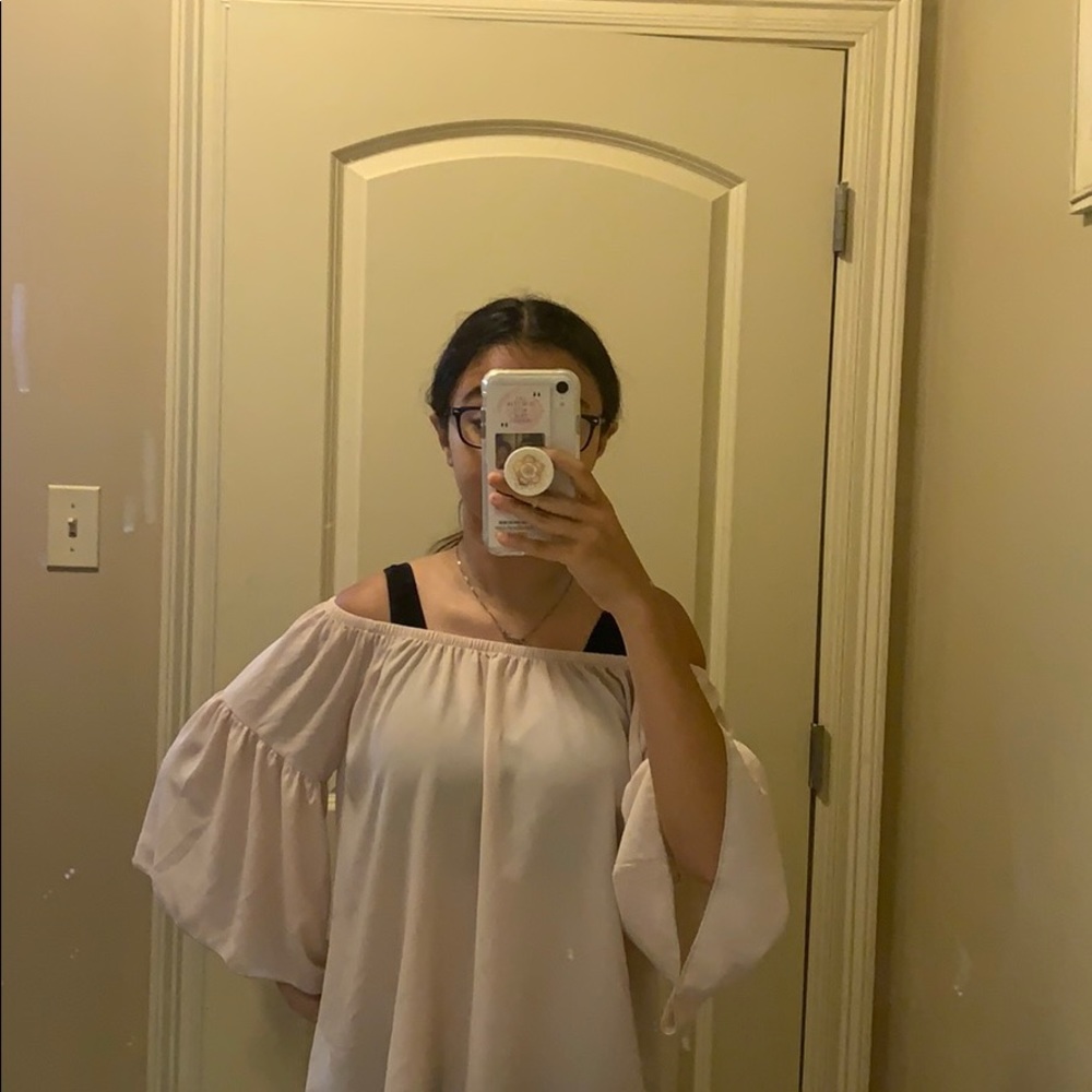 its a off the shoulder , light , flowy , blouse .